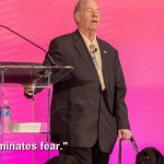 Michael Hingson and Alamo at podium